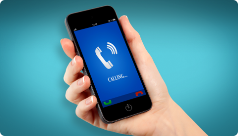 A hand holding a smartphone calling someone.